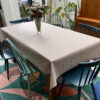 Olympia Blush Patterned Matt Oilcloth Tablecloth on Dining Table